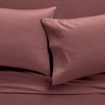 Colorful stack of sheets available in multiple colors and patterns, they are smooth, snug and secure with technology that moves with you as you sleep. 