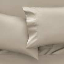 Temperature balancing bedding on a dressed bed to help keep you cool while you sleep 