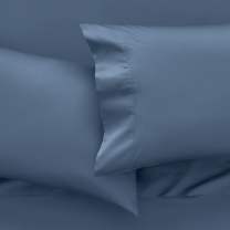 Temperature balancing bedding on a dressed bed to help keep you cool while you sleep 