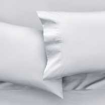 Temperature balancing bedding on a dressed bed to help keep you cool while you sleep 