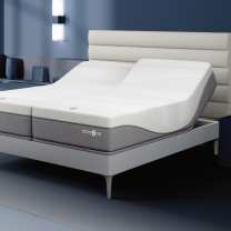 Sleep Number i10 mattress with a white horizontal panel headboard