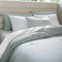 Sleep Number Cozy comforter in dark gray/fog stripes on a Sleep Number mattress