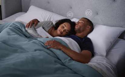 Couple sleeping in their sleep number bed