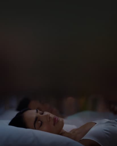 woman sleeping on a bed
