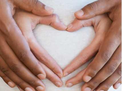 Pregnant woman with her partner holding hands