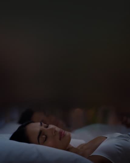 woman sleeping on a bed