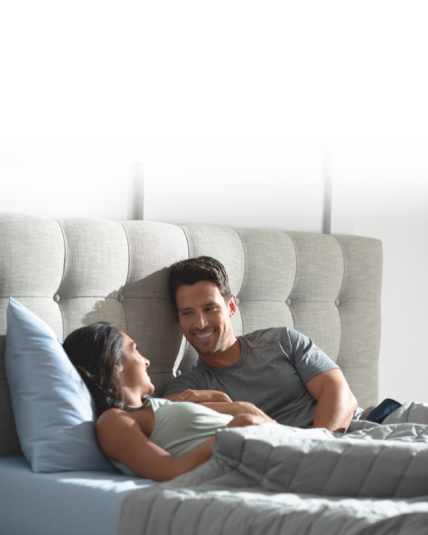 couple awake and talking in bed