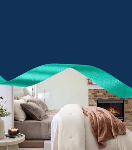 Side view of Sleep Number bed with wintersoft sheets, blankets, comforters, throws and pillows