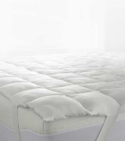 Bedding stack with True Temp blanket, weighted blanket, sheets and pillow.