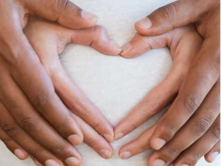 Pregnant woman with her partner holding hands