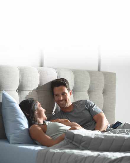 couple awake and talking in bed