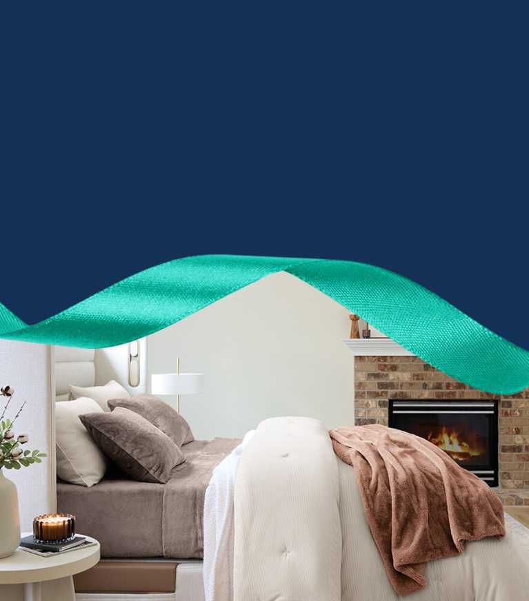 Side view of Sleep Number bed with wintersoft sheets, blankets, comforters, throws and pillows