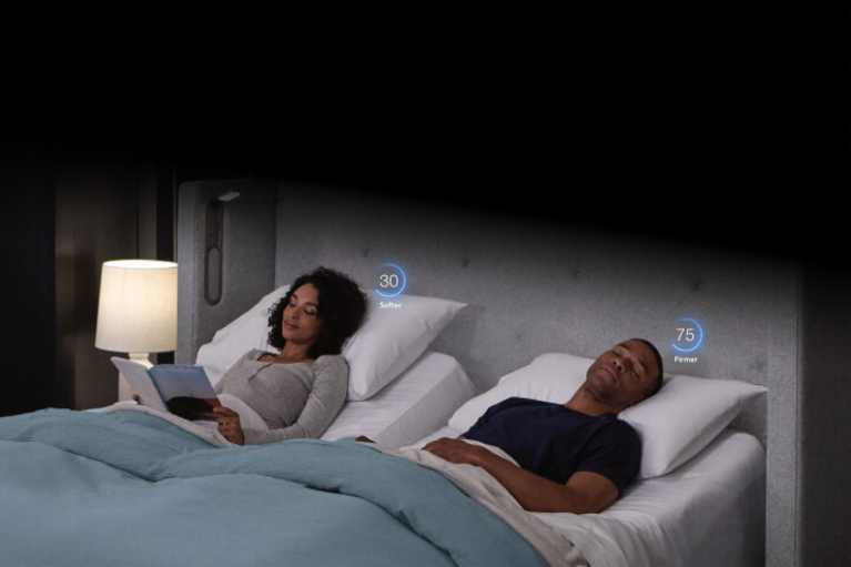 couple laying on an inclined adjustable smart bed