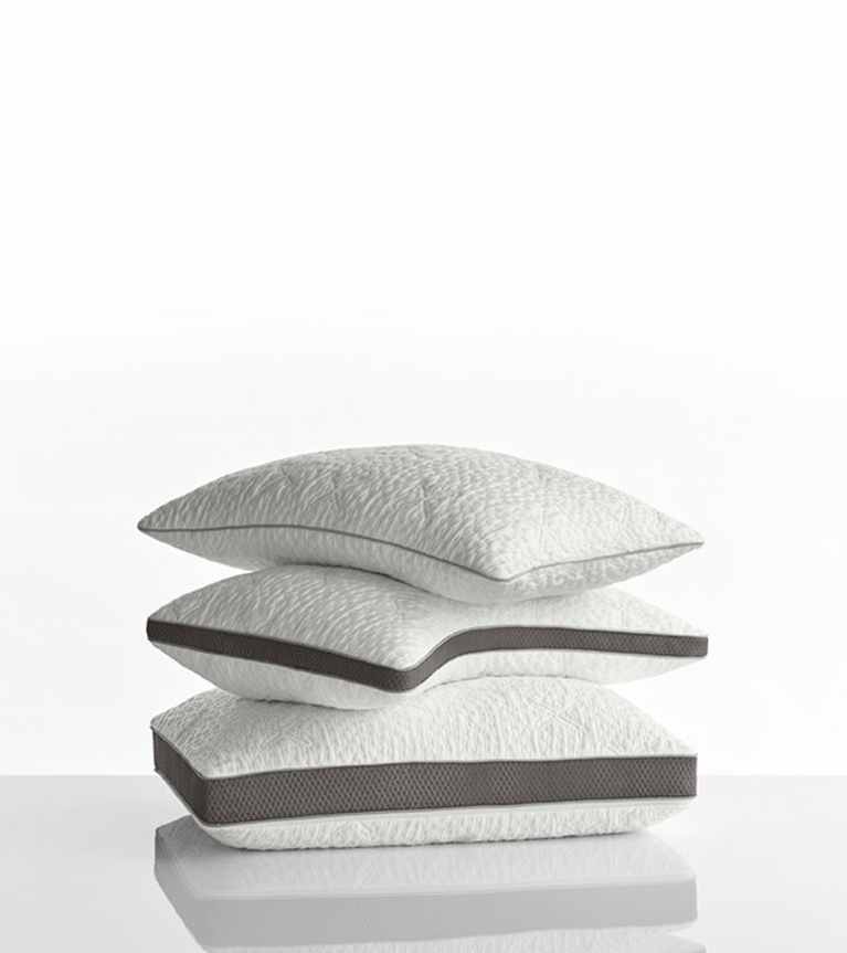 Stack of the NaturalFit pillow in standard, curve and ultimate shapes.