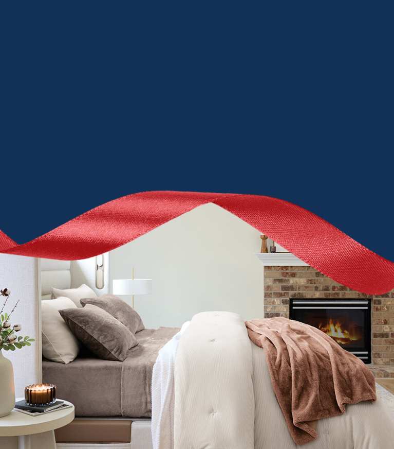 Side view of Sleep Number bed with wintersoft sheets, blankets, comforters, throws and pillows