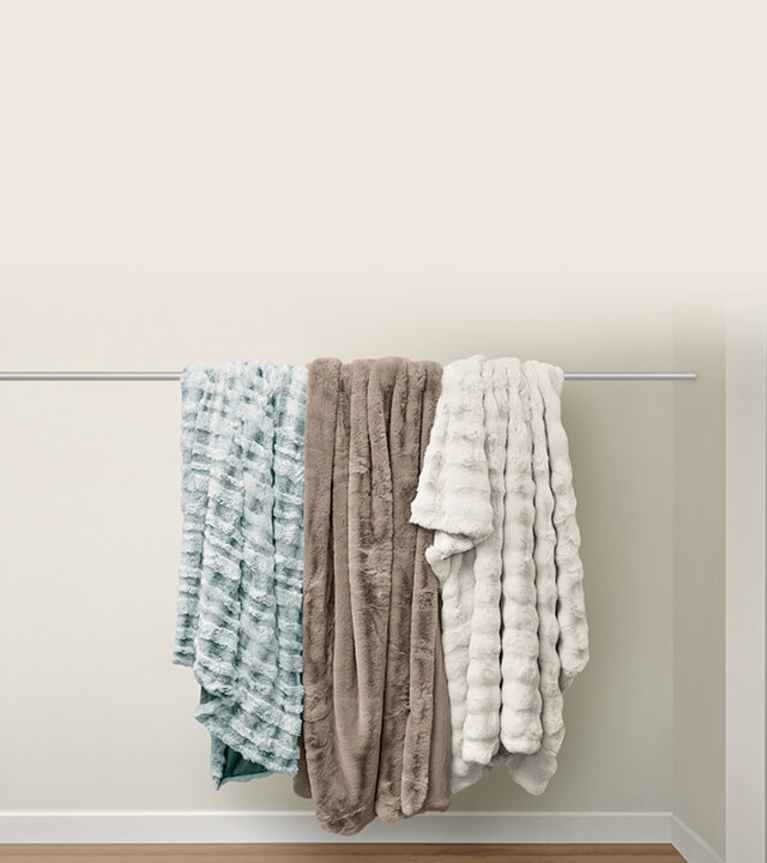 A set of colorful True Temp blankets in a vertical stack.