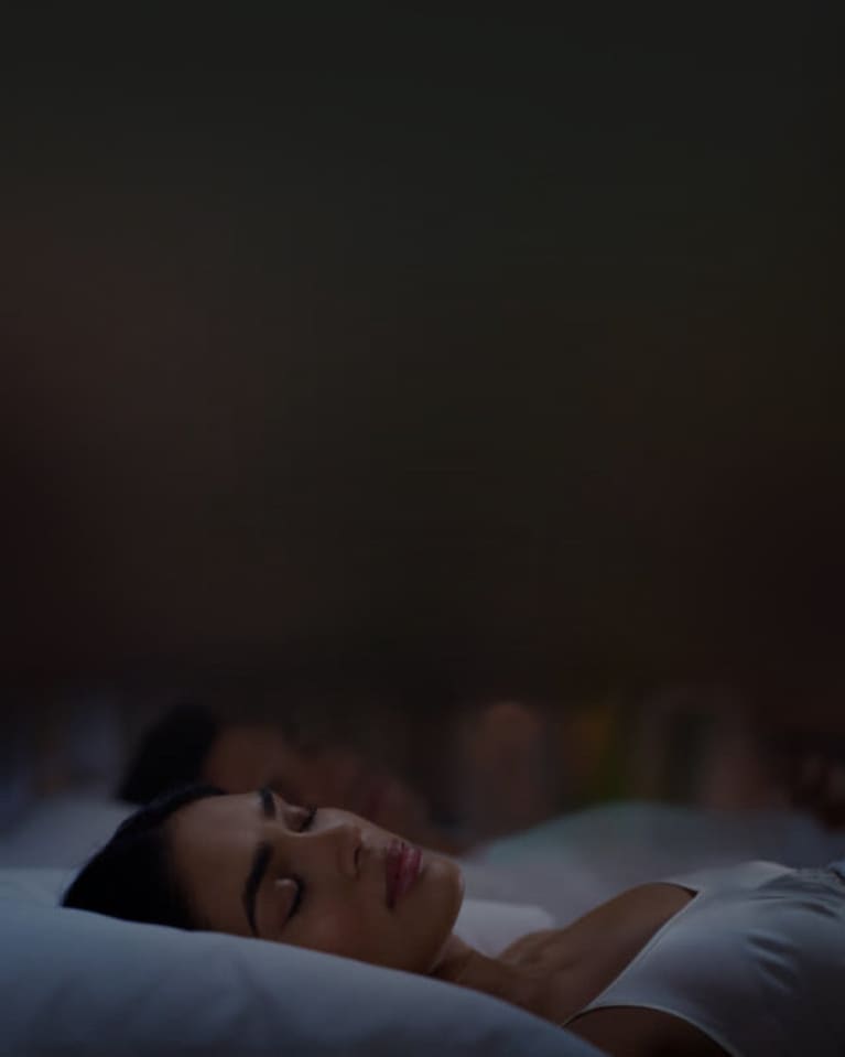 woman sleeping on a bed