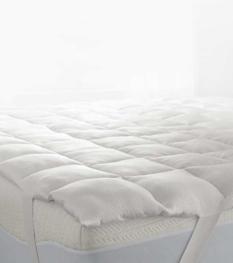 Bedding stack with True Temp blanket, weighted blanket, sheets and pillow.