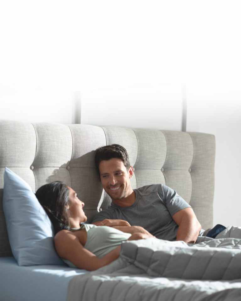 couple awake and talking in bed