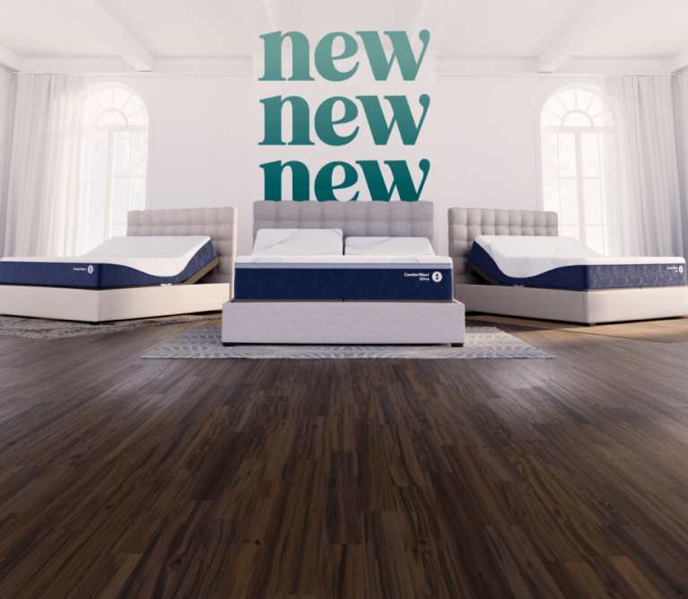 Three adjustable beds with blue‑and‑white mattresses displayed in a bright room, with the word ‘new’ repeated on the back wall.