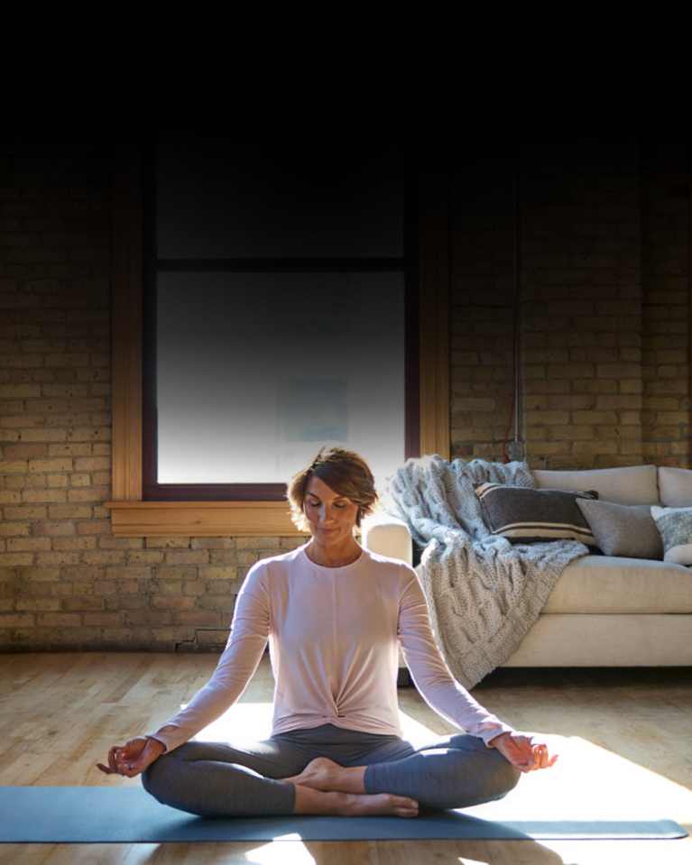 woman meditating during yoga