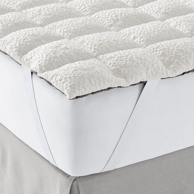 Close up image of our ComfortFit Mattress Layer that adds comfort through memory foam and down fibers