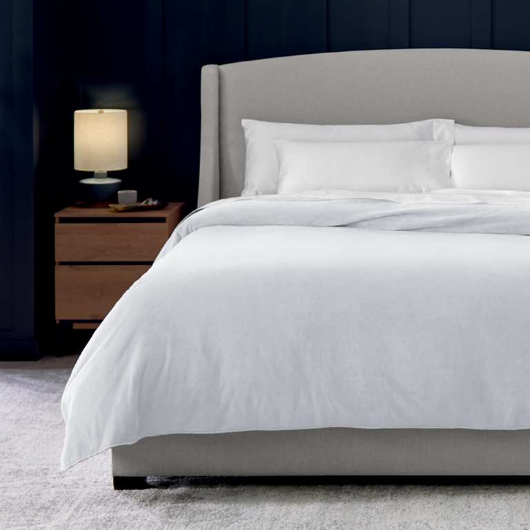 Plush Blanket on dressed bed designed for premium softness