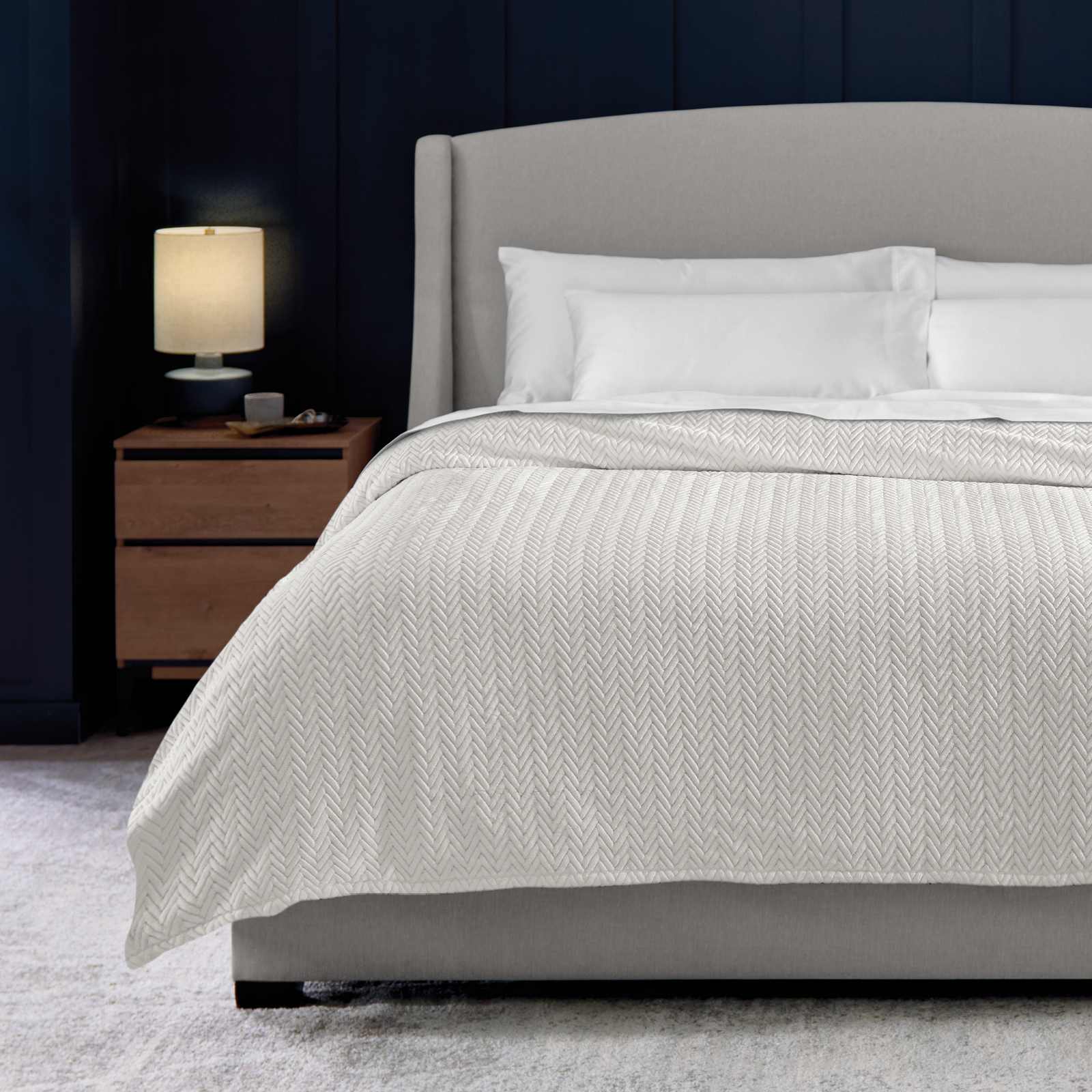 Plush Blanket on dressed bed designed for premium softness