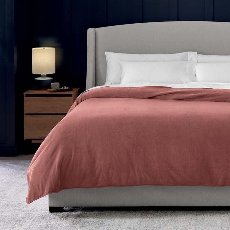Plush Blanket on dressed bed designed for premium softness