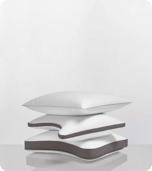 Stack of the NaturalFit pillow in standard, curve and ultimate shapes.
