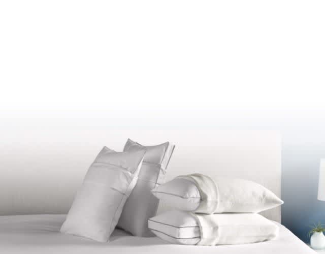 Pillows covered with pillow protectors: 1 set cotton and 1 set True Temp balancing.