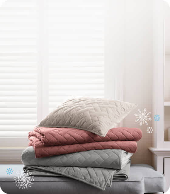 A set of colorful True Temp blankets in a vertical stack.