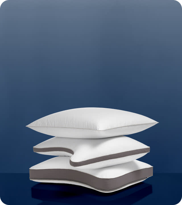 Stack of the NaturalFit pillow in standard, curve and ultimate shapes.