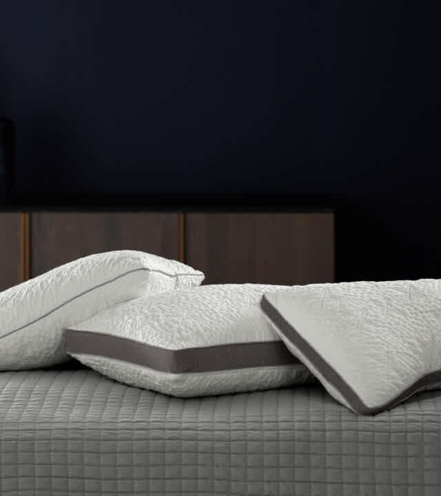 Stack of the NaturalFit pillow in standard, curve and ultimate shapes.