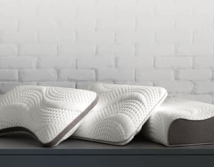 Pillows, image of stack of pillows, link to shop pillows